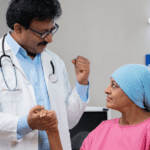 Doctor consoling patient with breast cancer