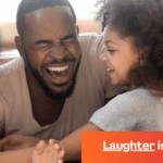 Black dad, mom, and daughter laughing