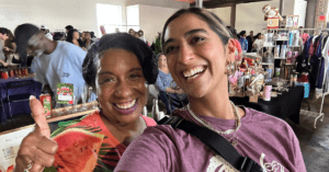 Two NOWINCLUDED community members taking a selfie at the Dallas Soul Food Festival