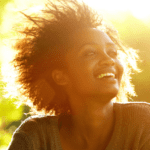 Black woman enjoying sitting in the sun