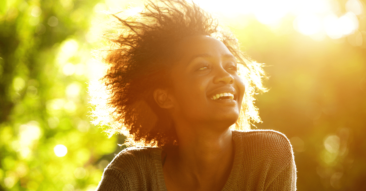 Black woman enjoying sitting in the sun