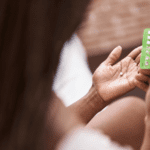 Woman holding birth control pills in her hands