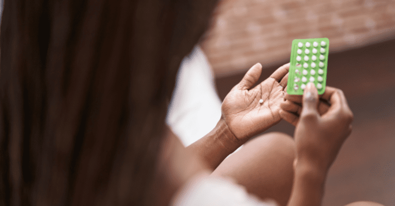 Fighting the Unseen: My Journey with Breast Cancer 1 Woman holding birth control pills in her hands