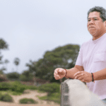 Man with vitiligo standing outside with a worried look on his face