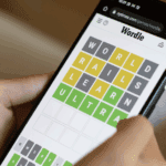 Close-up of a person playing Wordle on their phone