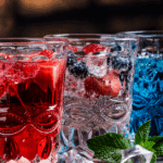 Red, white, and blue drinks in clear glasses