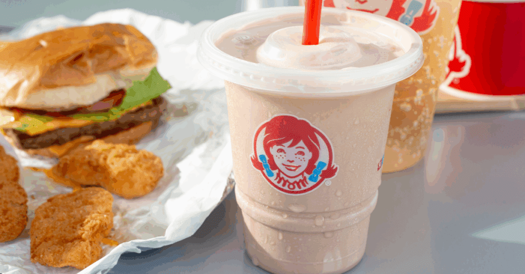 Wendy’s frosty with baconator and nuggets in the foreground