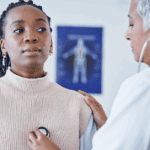 African American woman getting her heart checked at the doctor’s