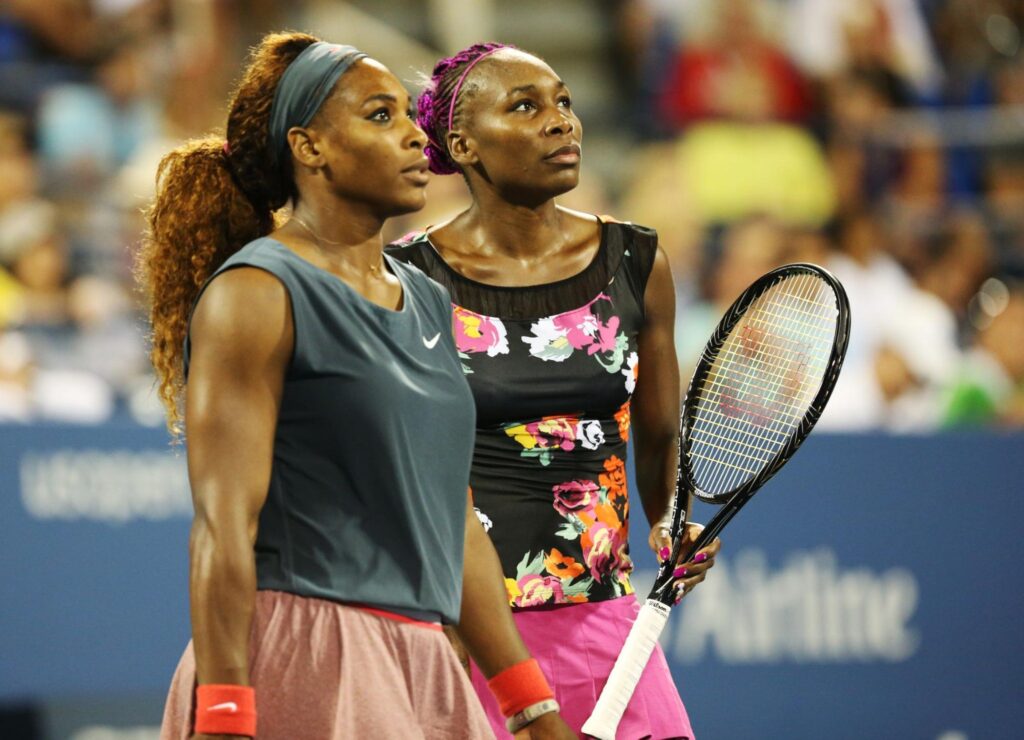 Serena Williams and Venus Williams during their first round doubles match at US Open