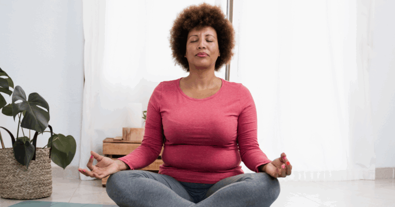 Lymphoma 101: What is it and could I be at risk? 1 Middle-aged African American woman sitting with her legs crossed on a yoga mat in a meditative pose