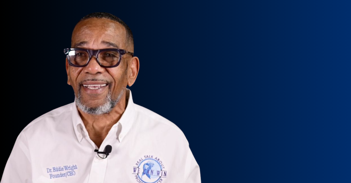 Dr. Wright, founder of the “We Can Win Foundation”, in front of a blue wall, talking about prostate cancer