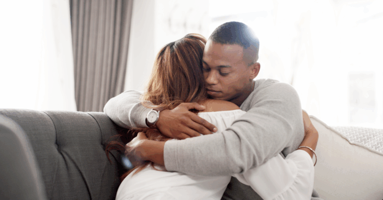 How to Spot Myasthenia Gravis (MG) Symptoms 1 Young African American man hugging a female who may have myasthenia gravis (MG)
