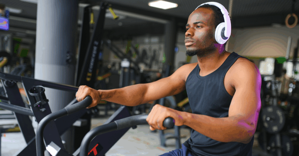 General Wellness 2 Young Black man using a peloton bike at the gym