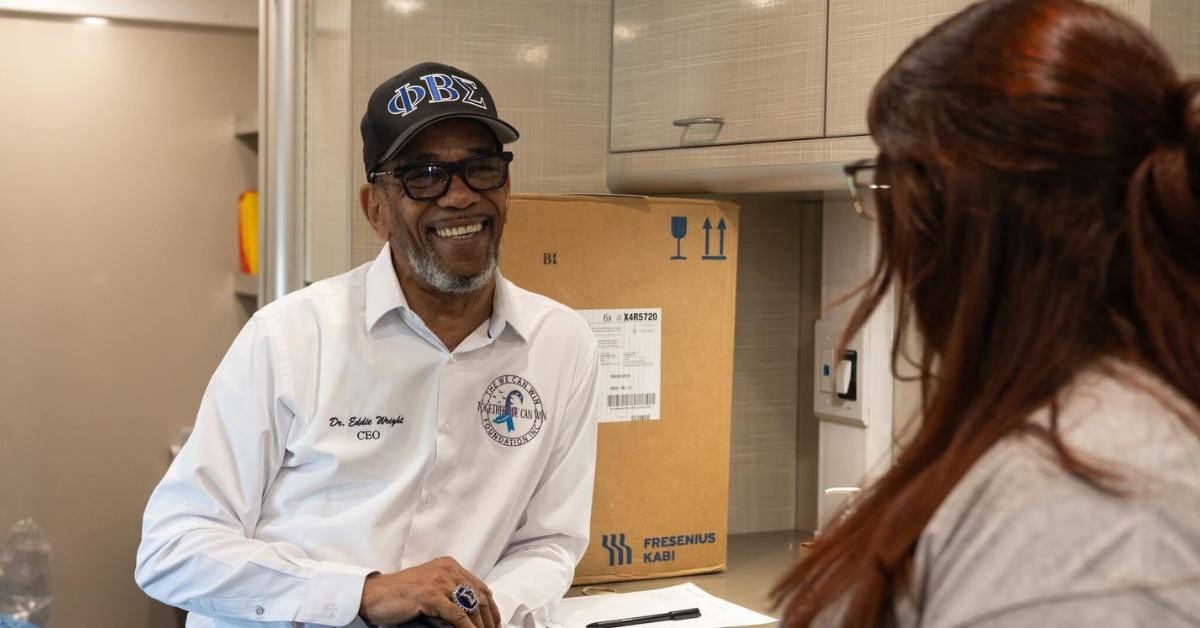 Dr. Edward Wright, founder of The We Can Win Foundation, in a fraternity baseball cap, smiling at a person off-camera