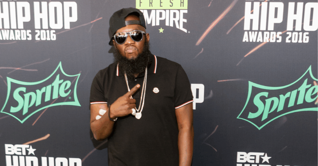 General Wellness 10 Philadelphia rapper and kidney disease survivor, Freeway, standing in front of a step and repeat banner