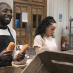 Smiling volunteers helping at a food bank during the loss of SNAP benefits