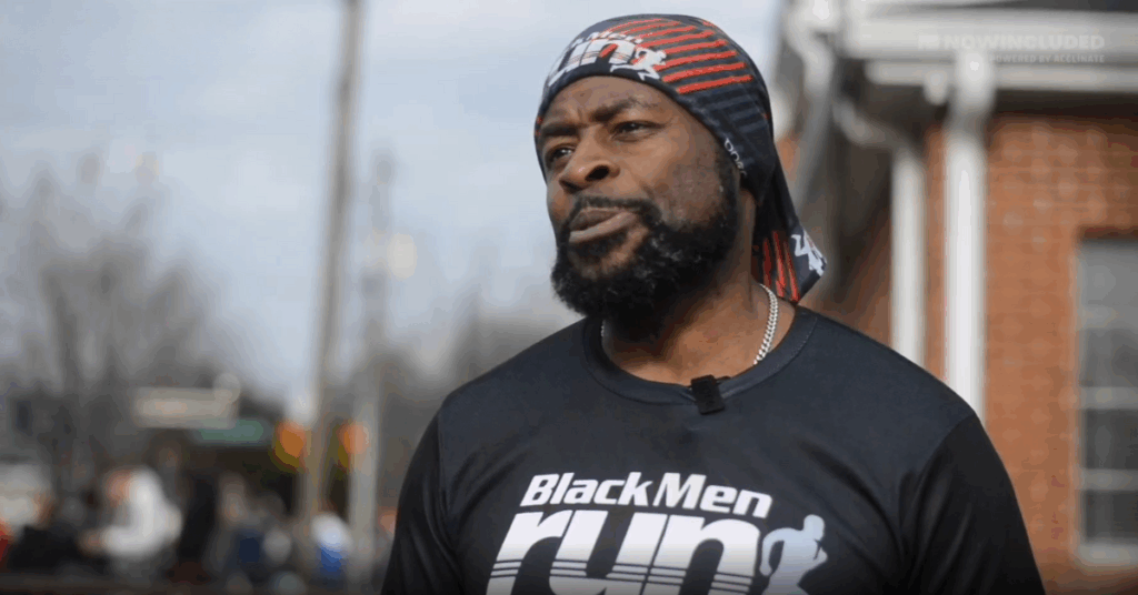 NOWINCLUDED community member, Oscar, in black shirt and head scarf, talking about his journey with type 2 diabetes.