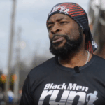 NOWINCLUDED community member, Oscar, in black shirt and head scarf, talking about his journey with type 2 diabetes.