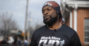 NOWINCLUDED community member, Oscar, in black shirt and head scarf, talking about his journey with type 2 diabetes.