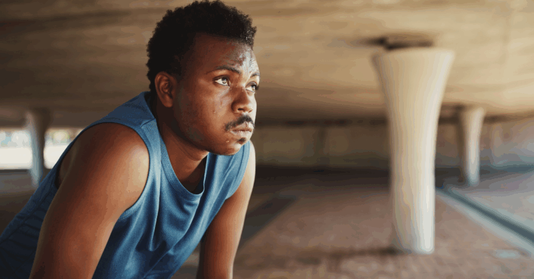 Radon and Lung Cancer: What’s the Connection? 2 Black man in a blue tanktop, sweating and out of breath, potentially due to heart failure