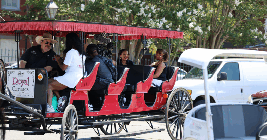 Alma Austin, Quench Hydration founder and ER nurse, and Tiffany Whitlow, co-founder and CDO of Acclinate, filming podcast on a buggy in New Orleans