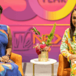 Tawa Mitchell, Senior Program Officer at the MacArthur Foundation and Tiffany Whitlow, Co-founder and CDO, Acclinate, smiling on stage at the Black Women’s Expo in Chicago.