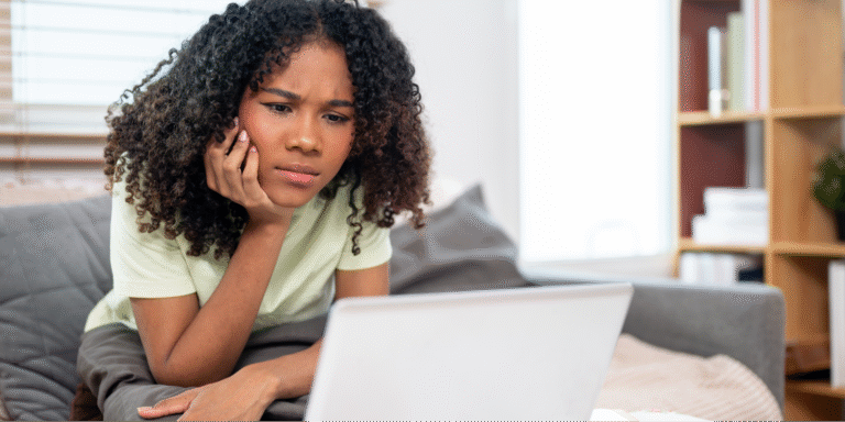 Understanding Genetic Testing and Your Health Risks 1 A young black woman carefully reviewing medical notes from her visit via a patient portal.