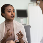 A young woman requesting a full hormone panel from her doctor in an exam room.